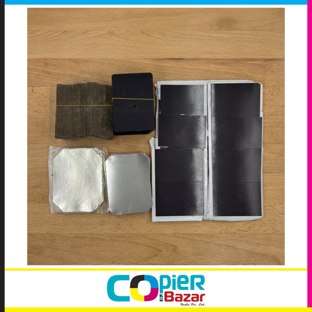 Complete 80x53mm fridge magnet raw material kit showing cardboard backing, magnetic sheets, metal tinplate shells and transparent protective film